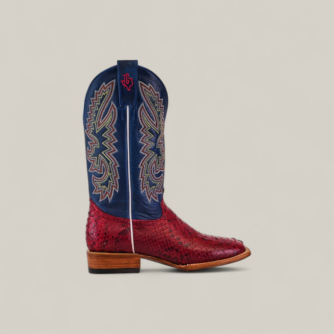 The Exotic Python - Ruby / Blue - Square Toe boot features a red python lower, tan sole and heel, blue upper with multicolored stitching, and a red Texas logo—an eye-catching pick from the Platinum Collection.