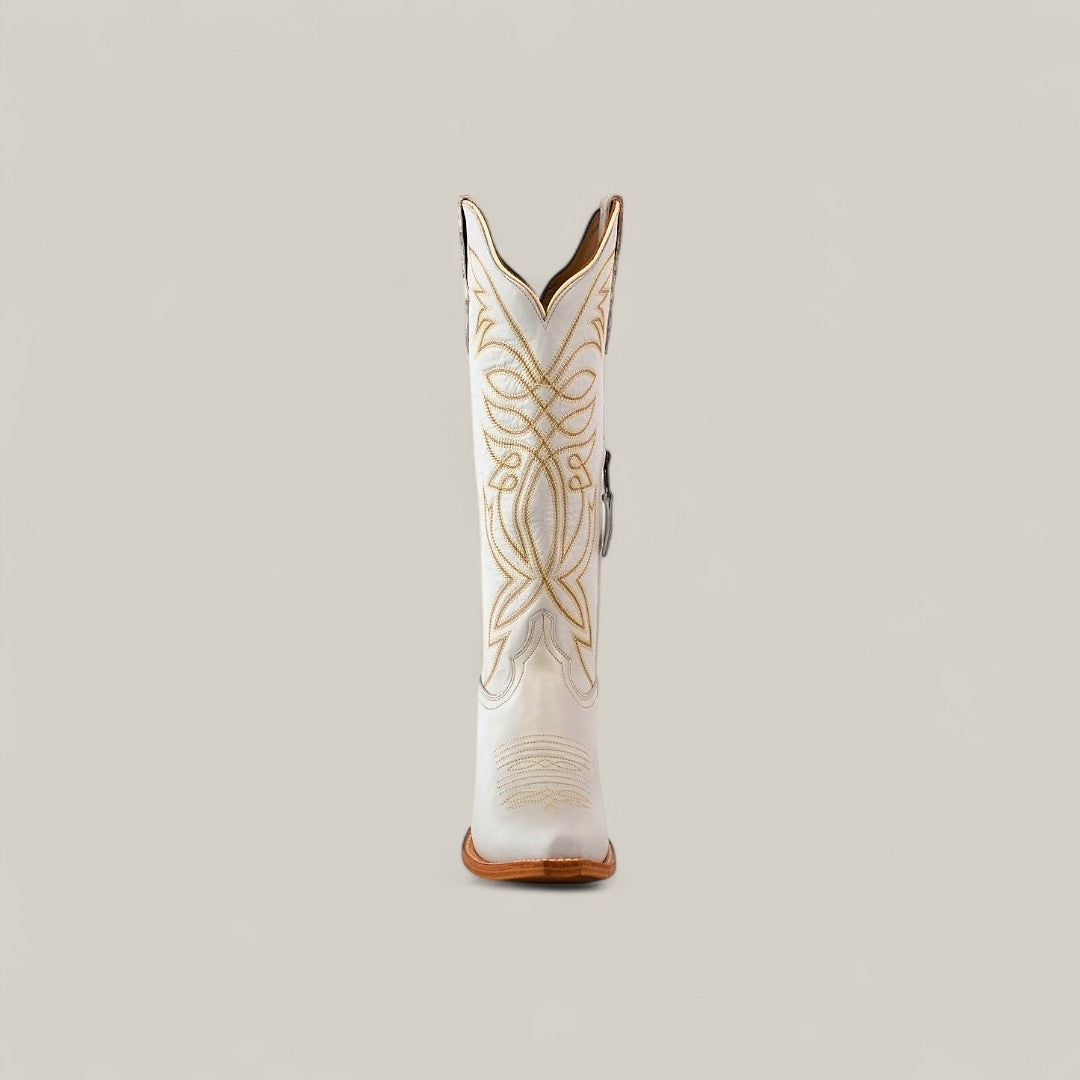 The Kellie Frost White Leather Sole Tall Shaft Snip Toe boot is shown from the front, highlighting its white leather and intricate tan stitching, set against a plain beige background.