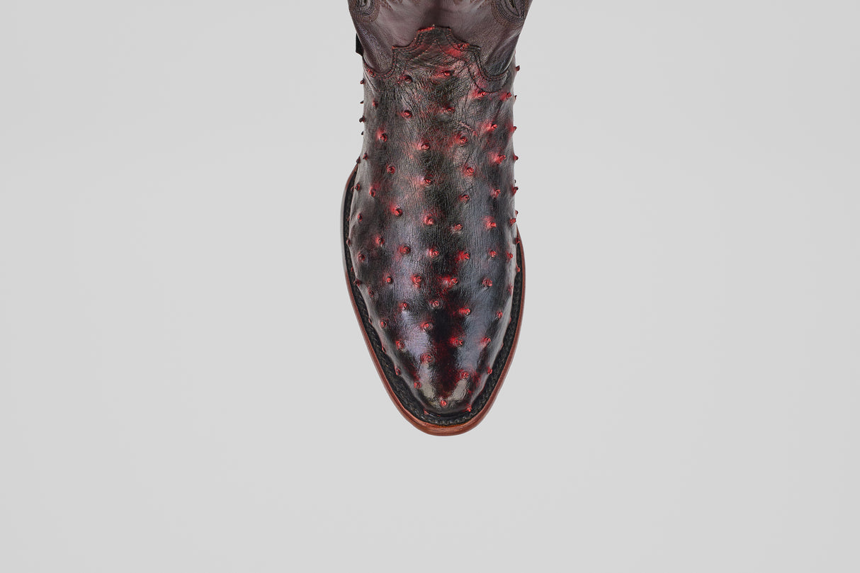 A single Exotic Full Quilt Ostrich boot in Black Cherry with a round toe and textured, raised quill pattern is displayed from above on a plain white background.