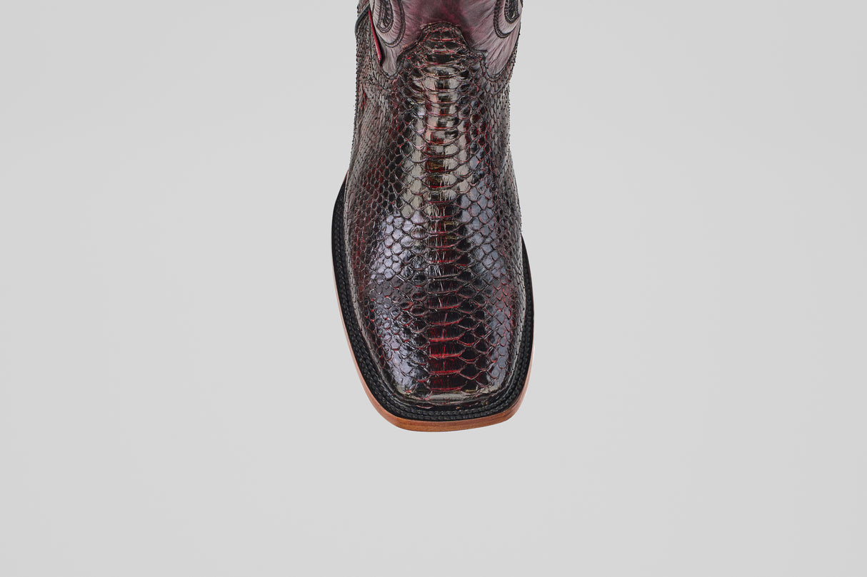 A top-down view of a single, square-toe, dark brown snakeskin cowboy boot—Tanner - Black Cherry - Square Toe—on a plain white background.
