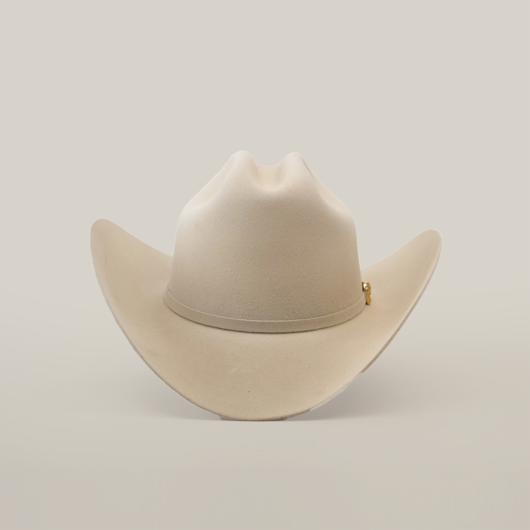 The 5X Dorado Belly is a light beige cowboy hat, made from fur felt, featuring a wide brim and slightly curved crown, presented on a plain white background.