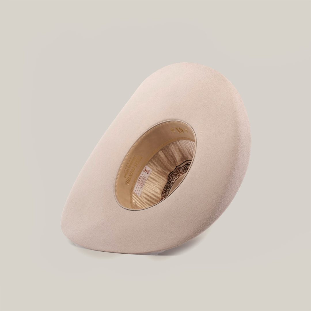 Viewed from above, the 6X Brazil Belly is a light beige felt hat featuring a wide, smooth brim and stylish shallow crown, complete with an intricate patterned premium leather band inside.
