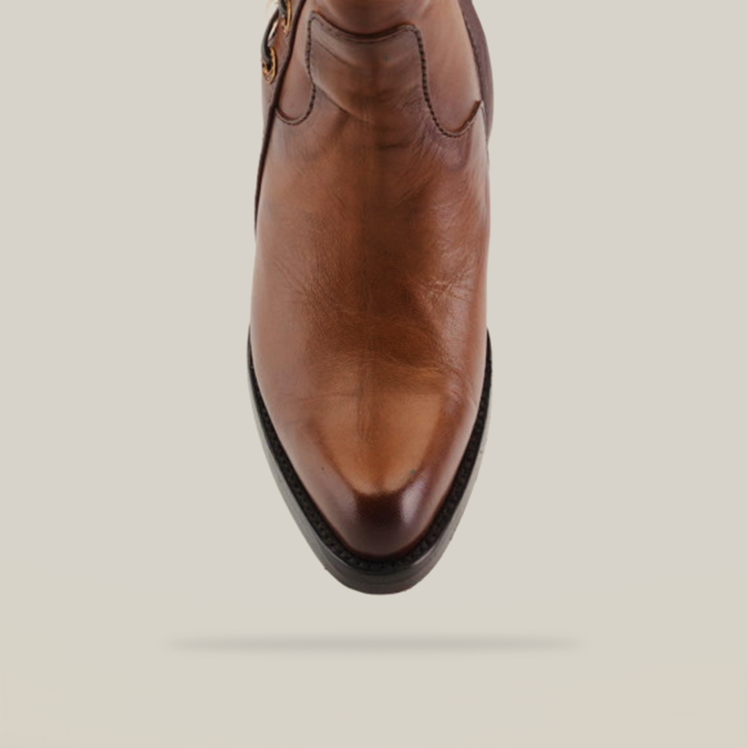 Top view of the Francia Rings Bootie Tan - J Toe in brown luxurious leather, showcasing its strap and side buckle. It features detailed stitching and a smooth finish, set against a white background.