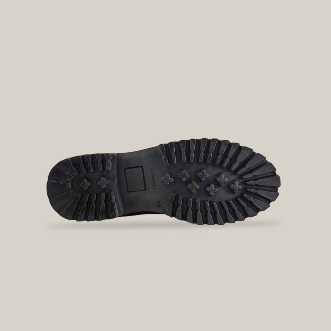 The image displays the Tan Roper - Tractor Sole - Soft Toes rugged sole, featuring deep treads and cross-shaped patterns on a white background. With grooves and a rectangular section near the center, it ensures exceptional traction and durability.