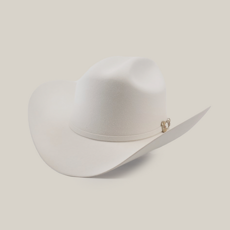 A white cowboy hat with a wide brim and a subtle decorative band around the base, set against a plain light background.