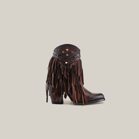 The product is the Austin Fringe Bootie Chocolate J Toe, a dark brown cowgirl boot with high heels, made from premium leather and adorned with layered fringe details and studs on the upper shaft, set against a plain white background.