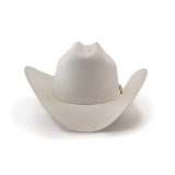 The 10X Jerarca White cowboy hat by Larry Mahan features a wide brim and slightly creased crown against a plain background. This fur felt hat has a simple hatband, embodying classic western headwear style.