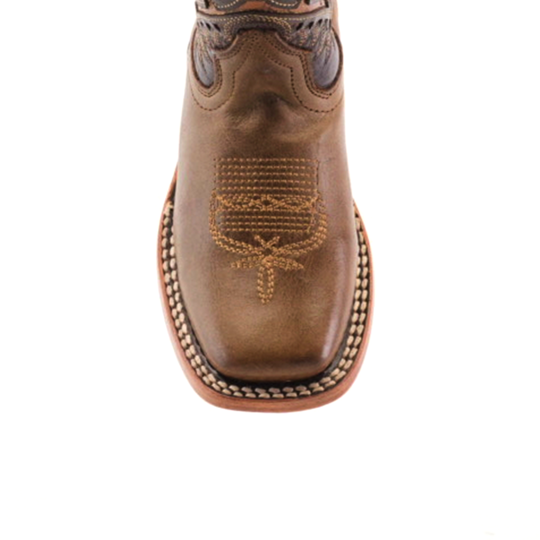 The Ranch Camel Square Toe cowboy boot in brown highlights western elegance with intricate toe stitching. Made from premium cowhide leather, it features a rounded front, decorative stitching along the sole, and is set against a plain white background.