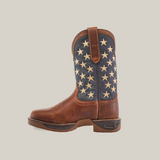 The Navy Brown US Flag Waterproof - Composite Toe boot, made from premium cowhide leather, showcases a rugged design with a brown leather foot and a blue upper decorated with white stars. The boot is set against a clean white backdrop.