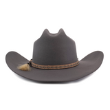 The 6X Doble SS Gris Oxford is a brown felt cowboy hat made from premium sheeps wool, featuring a wide brim, decorative band with tassel, classic pinch-front crease, and stylish upturned sides for that iconic Western look.