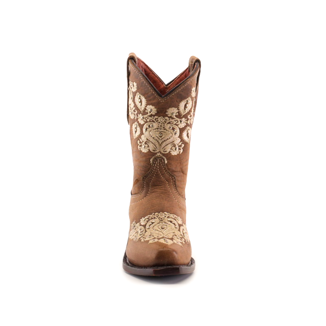 Front view of a Martey Crystals Sahara - Snip Toe cowboy boot in brown, featuring intricate white embroidery and subtle crystal embellishments on the shaft. The boot boasts a pointed toe and slightly arched top, set against a plain white background, exuding elegance and Western charm.