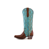 The Premier Tabaco Handtooled Flowers boots feature a brown leather foot, a tall turquoise shaft with swirl patterns, an angled heel, decorative stitching for Western elegance, and floral tooling similar to the design. They are shown upright on a white background.