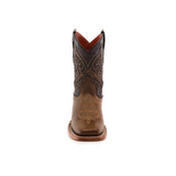 The Ranch Camel Square Toe is a single brown cowboy boot made from cowhide leather, featuring intricate stitching and a slightly pointed toe, displayed upright against a white background. It captures western elegance with a darker upper section adorned with detailed patterns.