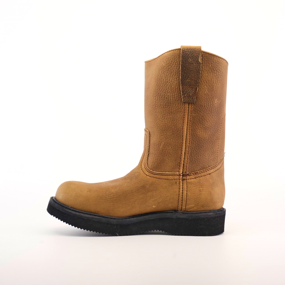 The Tan Roper - Laredo Sole - Soft Toe is a tan mid-calf leather boot made from premium cowhide, featuring a round toe and the signature Tan Roper Laredo Sole. Displayed in profile against a plain white background, the boot has minimal stitching, a slight heel, and embodies classic work boot style.