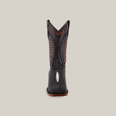 Front view of the Exotic Stingray Herradura cowboy boot, showcasing intricate brown stitching and a textured shaft. It features a broad square toe with a light-colored oval decoration, all set against a plain white background.