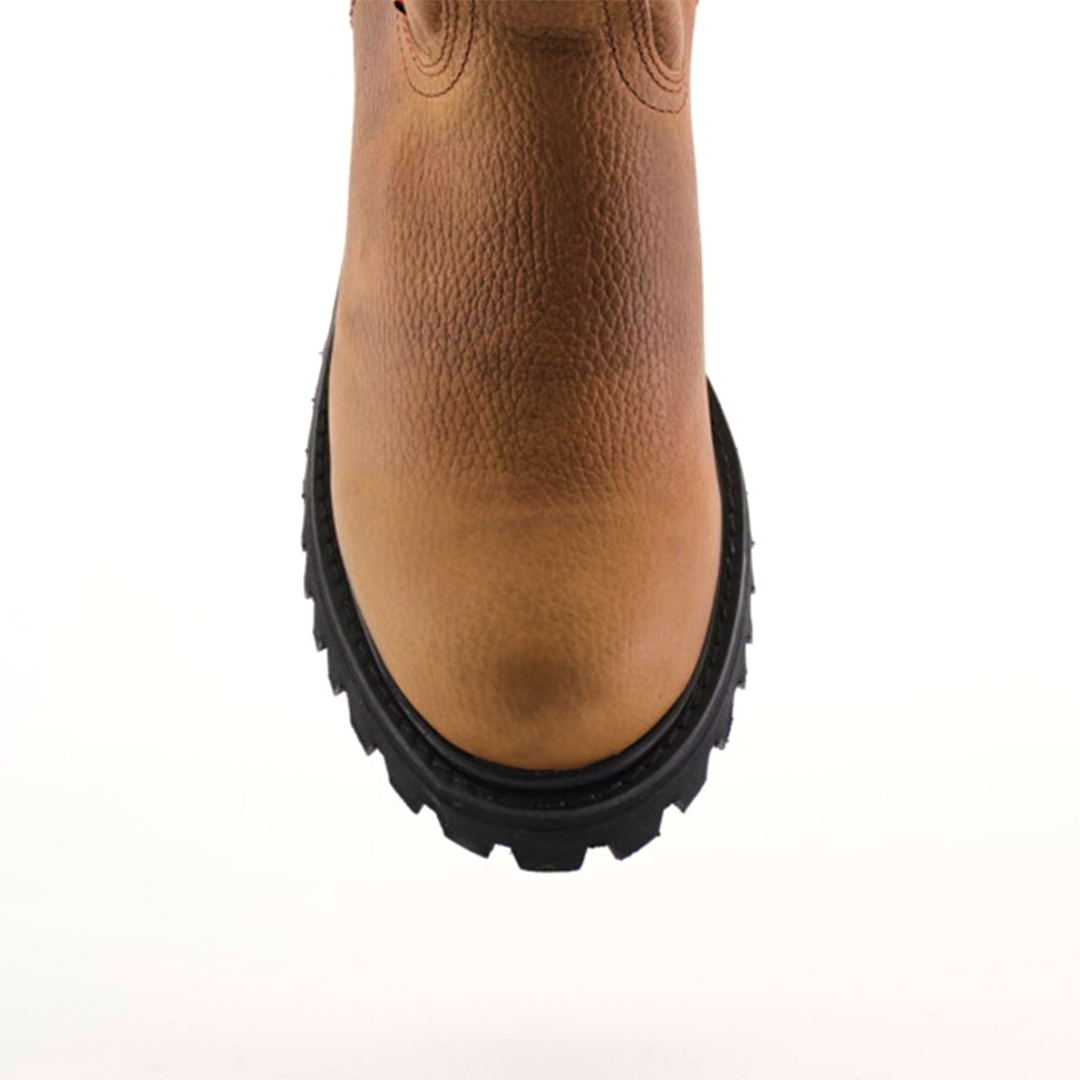 Front view of the Tan Roper - Tractor Sole - Soft Toe boot in brown leather. Made from premium cowhide with a textured surface and rugged black rubber sole, highlighting its durability and design against a white background.