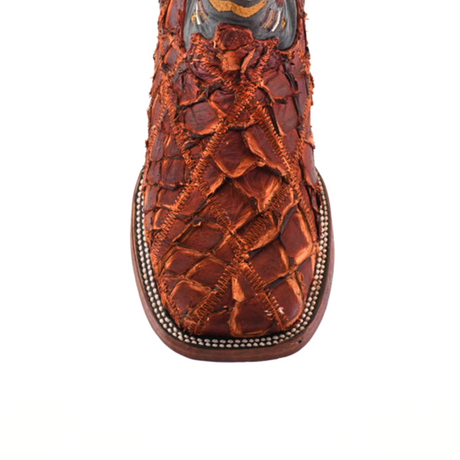 A close-up of the Exotic Pirarucu Fish Patchwork Cogñac Square Toe boot showcases intricate textured patterns reminiscent of exotic fish skin and decorative stitching at the top, isolated beautifully on a white background.