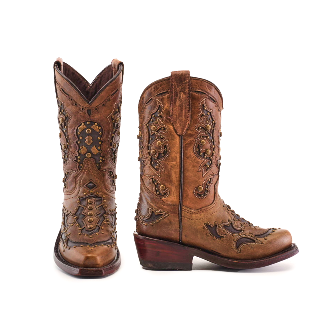 The Arass Studs Orix Snip Toe cowboy boots are brown, crafted from cowhide leather. They feature intricate embroidery, studded details, pointed toes, and wooden heels. The left boot displays front and side views, and the right boot shows a side view.