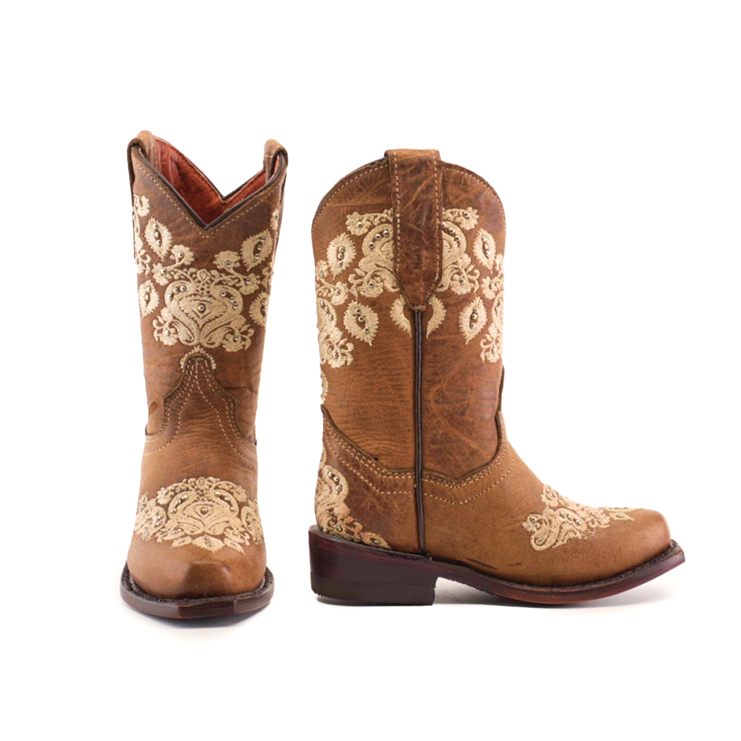 The Martey Crystals Sahara - Snip Toe are elegant brown cowboy boots featuring detailed cream embroidery and crystal embellishments on the shafts and vamps, one displayed facing forward and the other in profile.