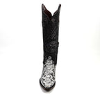 Black cowboy boot with intricate white patterns on a white background