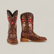 The Karo Brown Square Toe Kids Boots feature red and white floral embroidery with green leaf details on the shafts and toes, offering a classic design that blends comfort and elegance, shown against a plain light background.