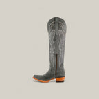 The Celine Gray - Tall Shaft - Snip Toe boot features dark gray suede, decorative stitching, a side zipper, pull strap, snip toe, and a wooden stacked heel, shown against a plain light background.
