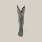 The Celine Gray - Tall Shaft - Snip Toe women’s black leather cowboy boot features white decorative stitching, a snip toe, and a wooden sole. Shown from the front on a plain light background.