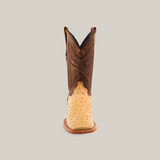 Front view of the Exotic Full Quilt Ostrich - Orix - Square Toe boot featuring a light tan ostrich leather foot and a dark brown intricately stitched shaft, set against a plain beige background.