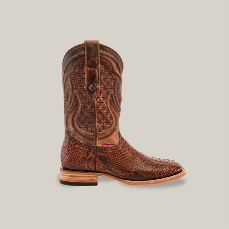 The Exotic Python - Brown boot features a modern square toe, intricate stitching, and textured python leather with smooth and patterned sections. It includes a wooden heel and pull tabs, offering a rustic yet classic look.