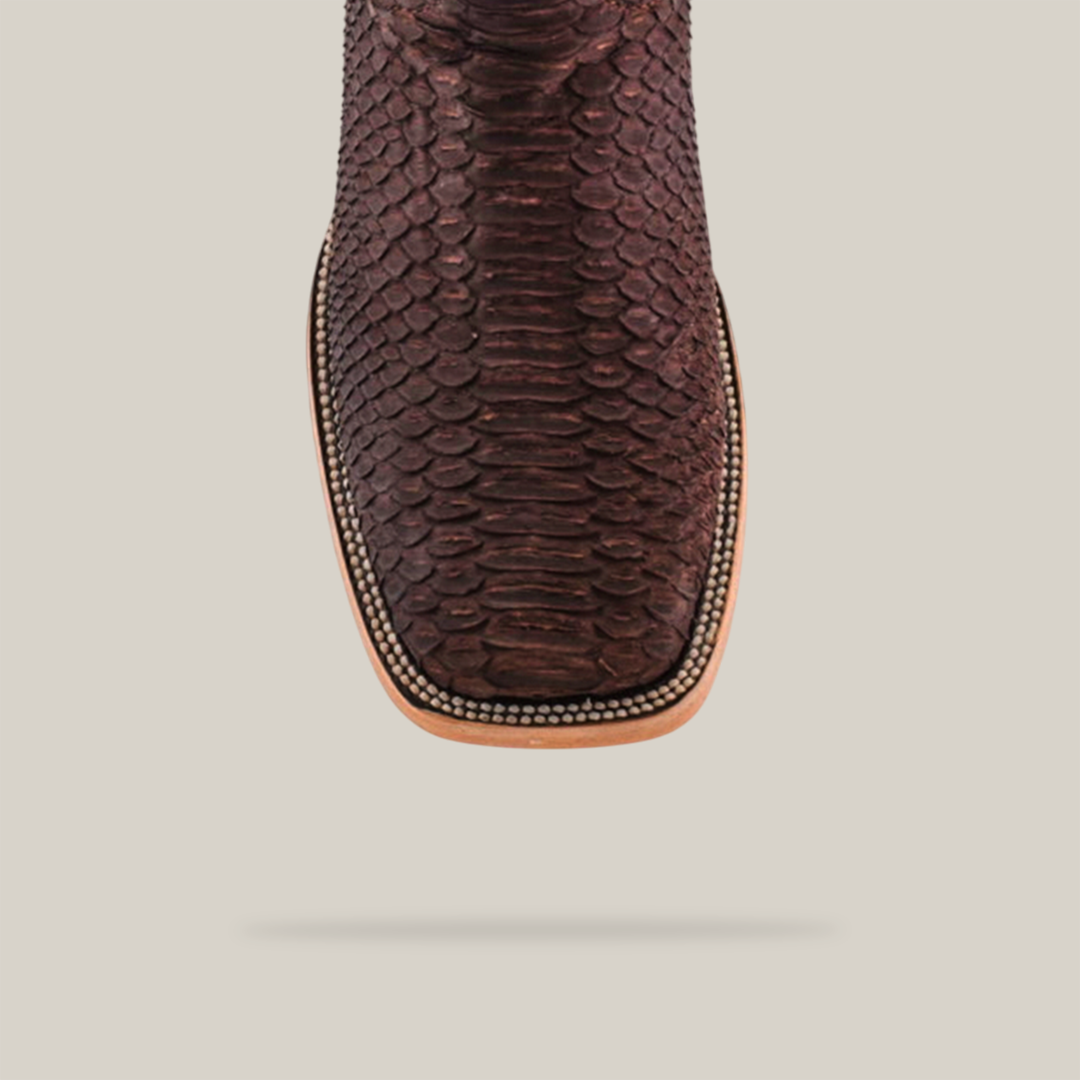 Overhead view of the Exotic Python - Matte Brown - Square Toe boot, featuring a striking python skin pattern, light tan sole, and intricate decorative border. Set against a plain light gray background.