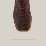 Overhead view of the Exotic Python - Matte Brown - Square Toe boot, featuring a striking python skin pattern, light tan sole, and intricate decorative border. Set against a plain light gray background.