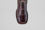 A close-up of the Exotic Alligator - BlackCherry- Square Toe boot shows its shiny, embossed alligator leather and square toe, photographed against a plain white background.