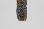 Close-up of the toe of the Butch - Caramel - Square Toe cowboy boot featuring decorative stitching and a textured pattern, crafted from luxurious Pirarucu leather for an exotic look.