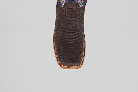A close-up top view of the Morgan - Matte Brown - Square Toe men’s boot, showing its textured matte brown finish, detailed stitched edge, and a hint of colorful design near the upper.