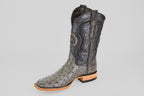 The Exotic Full Quilt Ostrich - Gray - Square Toe boot features decorative stitching, star detail on the shaft, textured ostrich leather, a wooden heel, and is displayed solo against a plain light gray background.