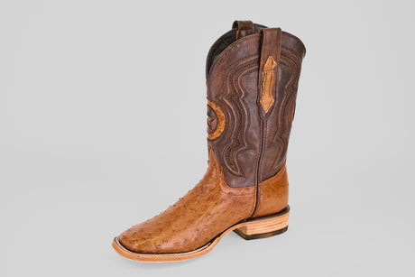 The Exotic Full Quilt Ostrich - Brandy Brucciato - Square Toe features a light tan ostrich lower, dark decorative shaft, classic square toe, and stacked heel for a timeless cowboy boot look.