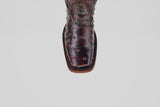 A top view of the Exotic Ostrich - Black Cherry - Rodeo Toe boot showcases its dark, textured ostrich leather and square rodeo toe, all displayed on a plain white background.