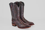 A pair of Exotic Full Quilt Ostrich - Black Cherry - Round Toe cowboy boots with decorative shaft stitching and textured black cherry accents, displayed on a plain light gray background.
