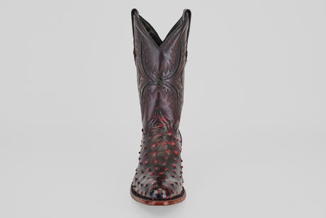 A handcrafted Exotic Full Quilt Ostrich boot in Black Cherry with a round toe, textured bumpy ostrich leather, and decorative stitching, displayed from the front against a plain light background—Western style.