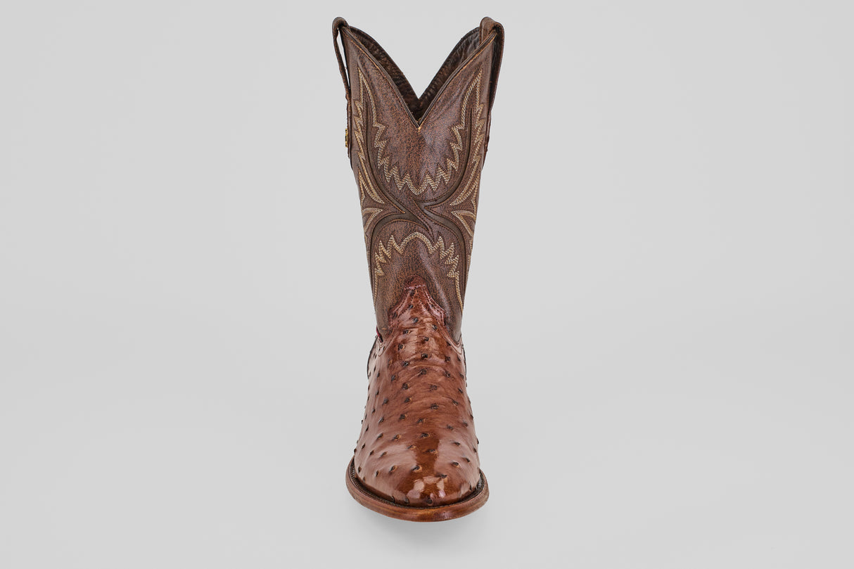 The Austin - Brown - Round Toe boot features intricate stitching on the upper shaft and a textured, glossy avestruz lower section in Kango Tabaco, displayed from the front on a plain white background.