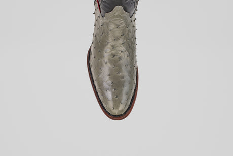 A top view of the Austin - Oxford - Round Toe men's cowboy boot, crafted from ostrich leather with a textured, bumpy surface and a brown sole, set against a plain white background.