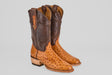 The Austin - Brandy - Roper Toe boots are men's cowboy boots with light brown textured ostrich leather foot, dark brown smooth leather shaft, decorative stitching, wooden heels, and classic roper toe styling.