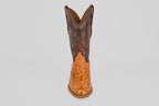The Austin - Brandy - Roper Toe is a men's cowboy boot featuring a brown leather upper and light tan textured ostrich leather lower, shown upright on a plain white background. Ideal for fans of classic ostrich leather boots.