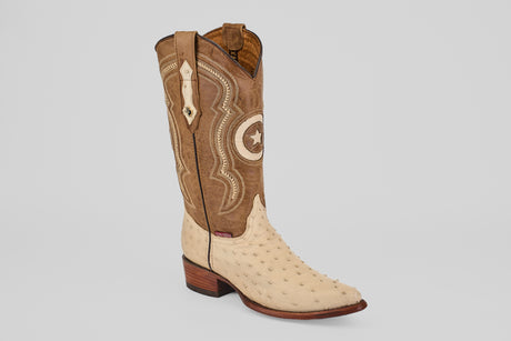 The Austin - Bone - Snip Toe is a western boot featuring a tan ostrich leather foot, light brown shaft with stitched patterns, pull straps, a wooden heel, and snip toe—ideal for ostrich leather cowboy boot enthusiasts.
