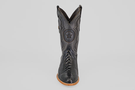 The Austin Leg - Black - Roper Toe is a black leather western boot with decorative stitching, a star emblem on the shaft, and a light brown sole, displayed front-facing against a plain white background.