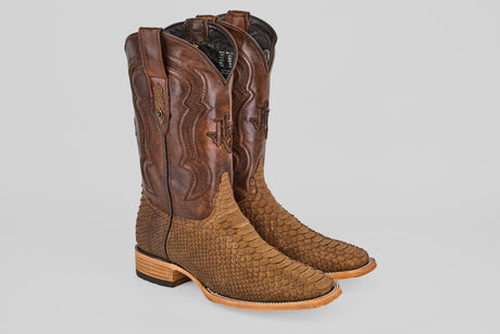 The Tanner - Tamarindo - Square Toe cowboy boots feature Python Tamarindo leather with a scale-textured lower half, a smooth, darker upper shaft, decorative stitching, and wooden heels.