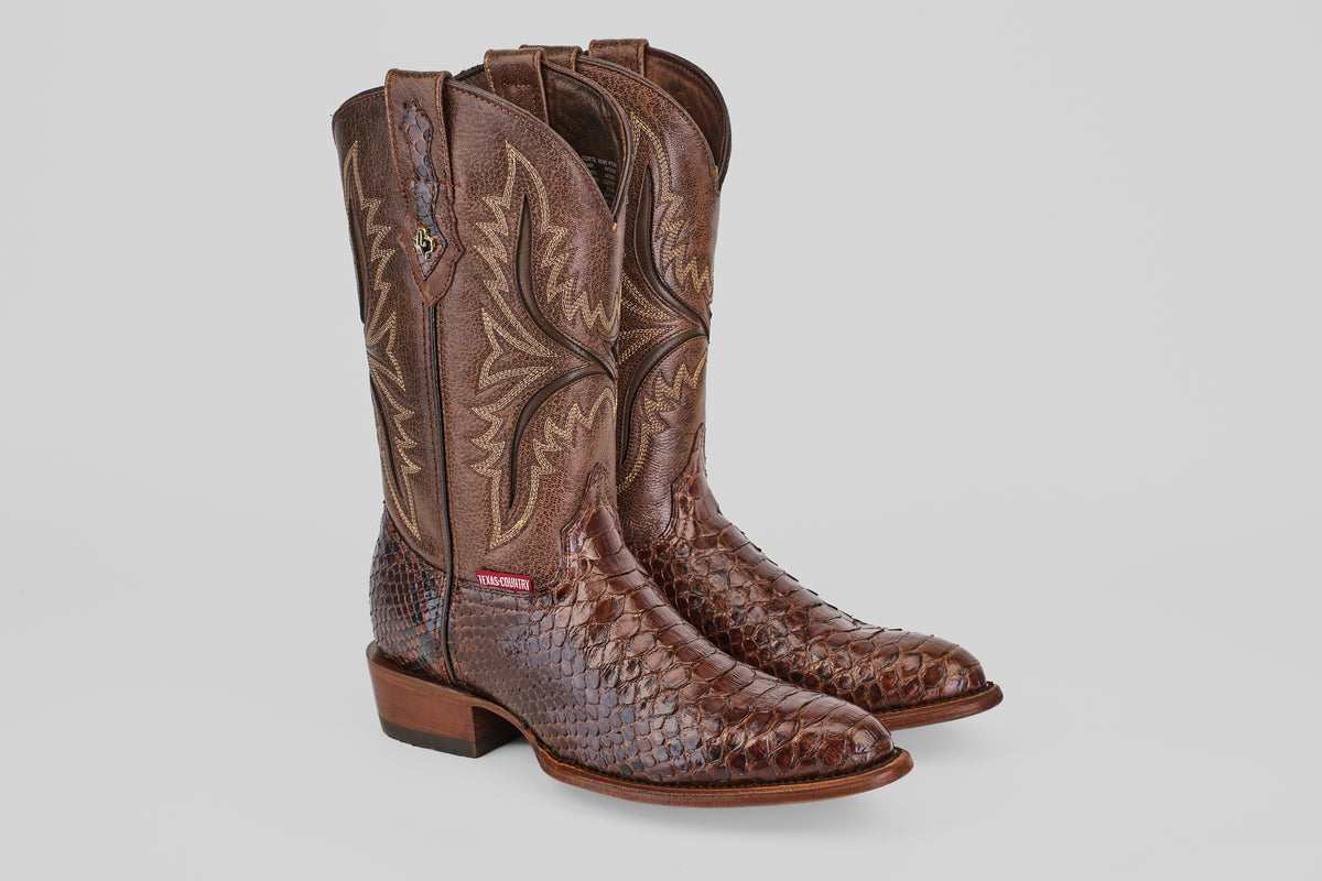 A pair of Tanner - Brown - Round Toe cowboy boots with a textured Python Cafe Oval snakeskin foot and decorative calf stitching, shown against a plain light background.
