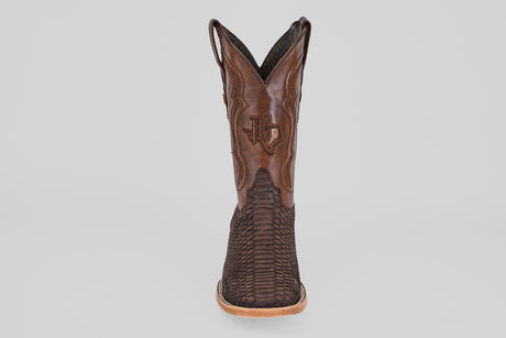 A single Tanner - Matte Brown - Square Toe cowboy boot, featuring a textured Python Cafe Nobuck foot, smooth leather shaft with decorative stitching, and tan sole, is shown from the front against a plain light background.