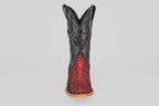 The Tanner – Scarlet – Square Toe is a western cowboy boot with a black upper and red python leather lower, detailed stitching, light brown sole, and square toe, shown from the front against a plain background.