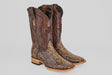 The Tanner – Dune – Square Toe boots feature brown leather shafts, snakeskin-patterned vamps, decorative stitching, light wooden heels, and a classic square toe, shown against a plain gray background.
